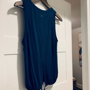 Lulu - cinch bottom tank. Open back. High neck line.